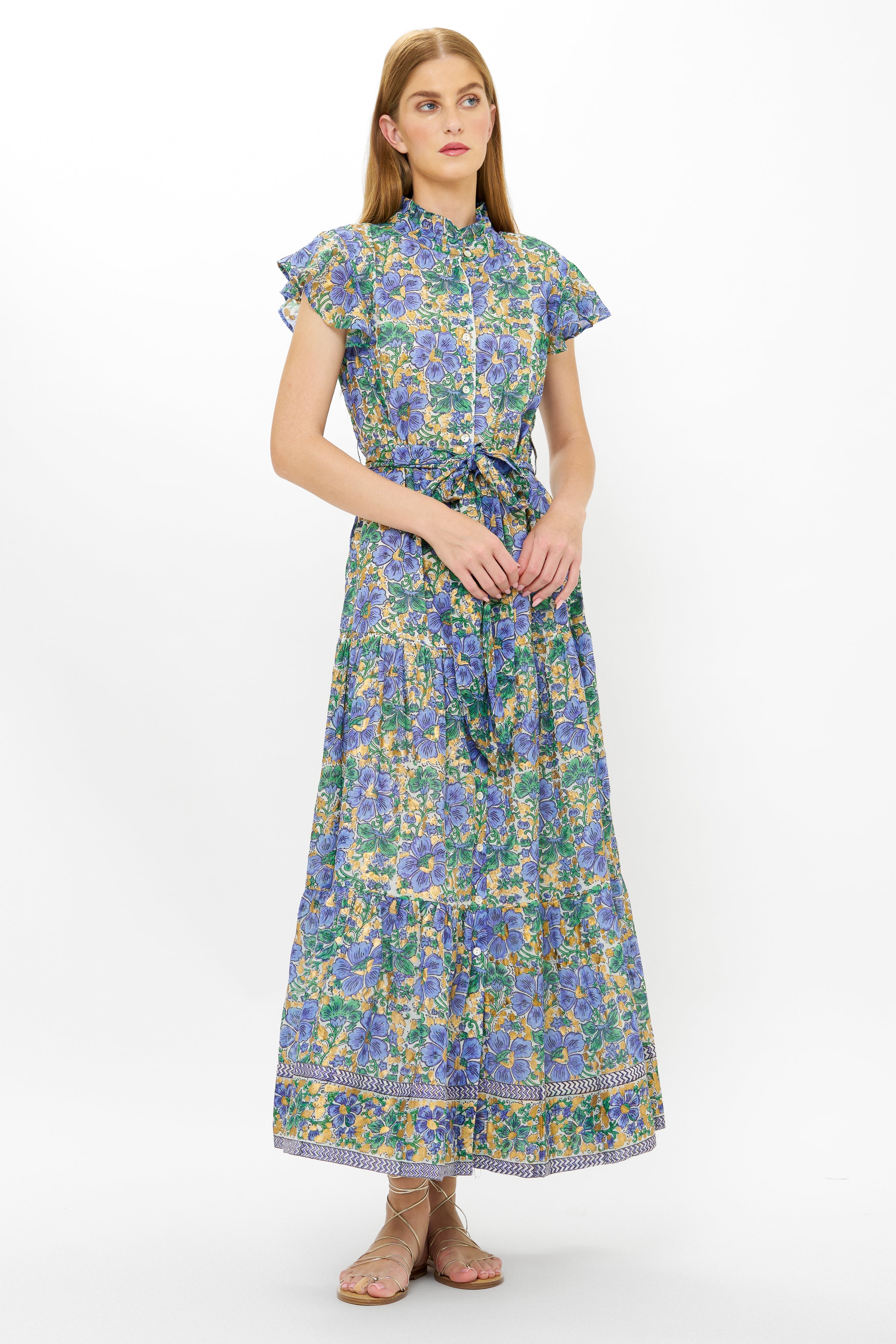 Woman wearing Oliphant Ruffle Collar Button Maxi dress in Taj Blue floral pattern