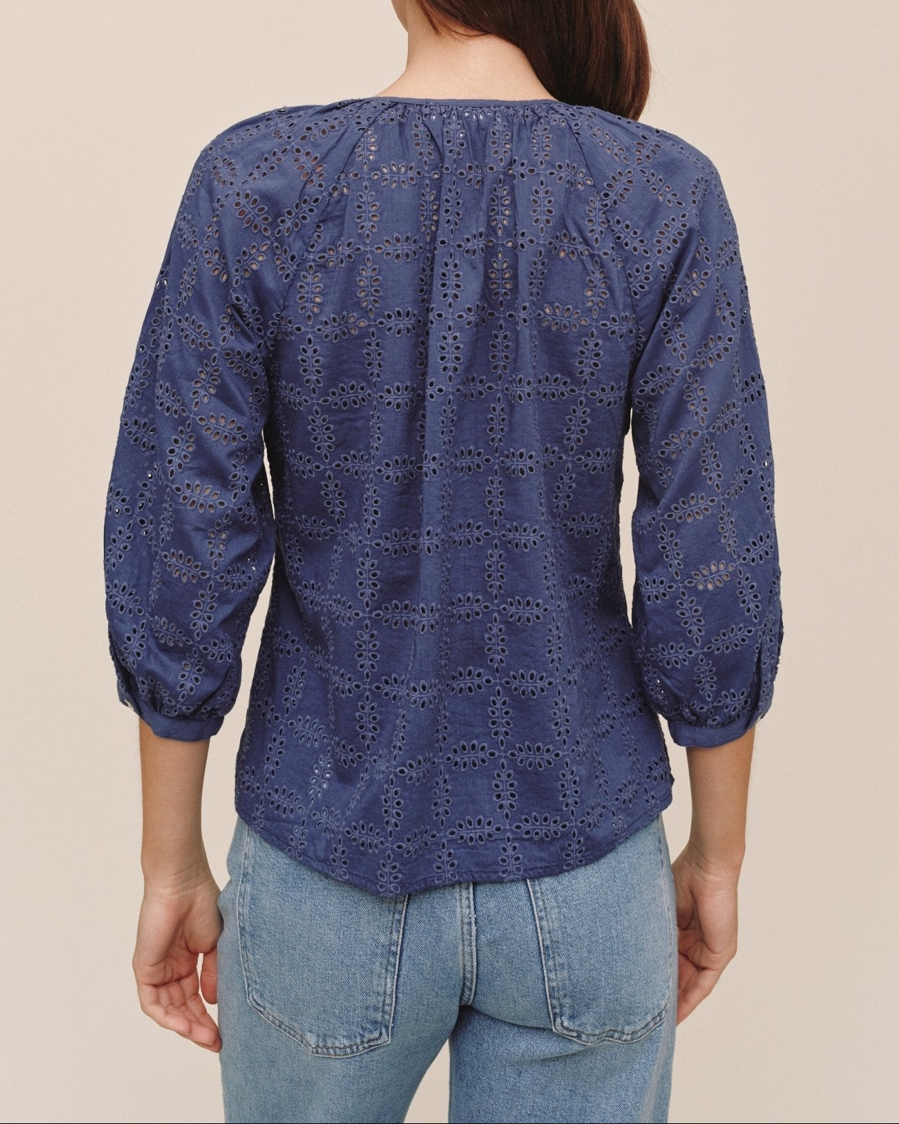 Bella Dahl navy indigo eyelet pullover blouse with 3/4 sleeves shown from back