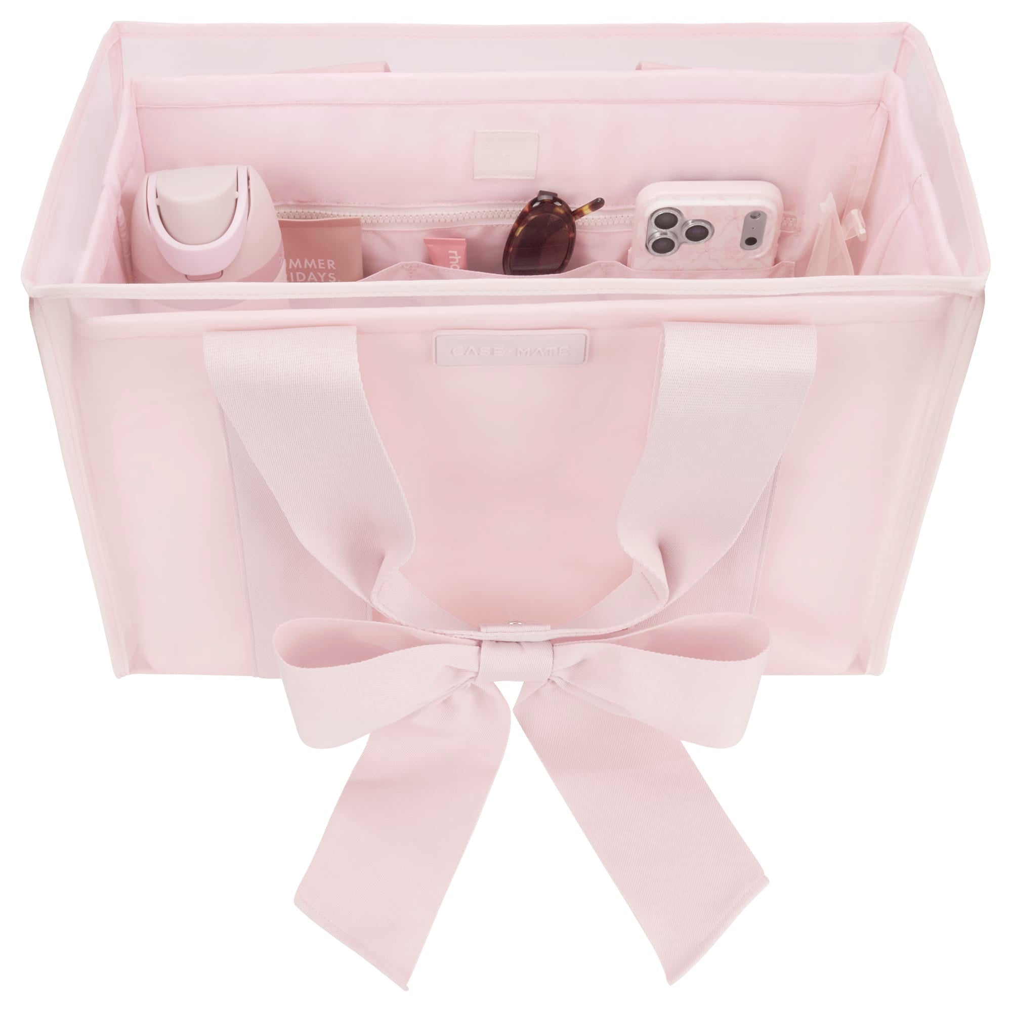 Case-Mate Ballet Pink tote organizer bag with bow detail, shown open with accessories inside