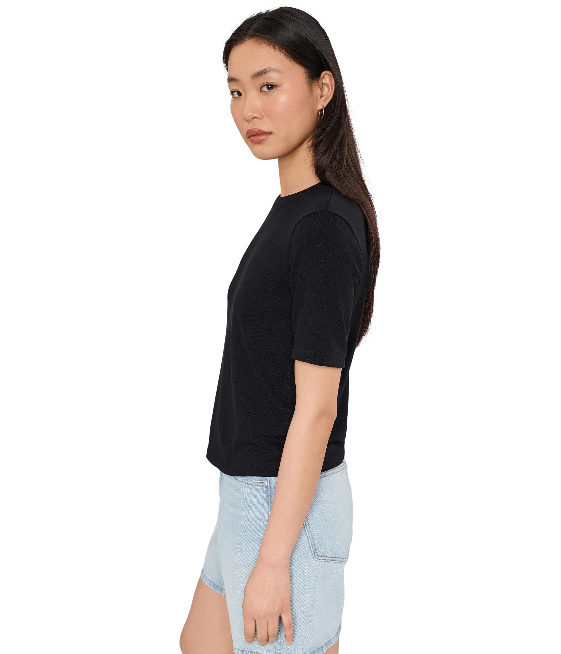 Woman wearing Michael Stars Frankie black crew neck tee with light blue denim skirt