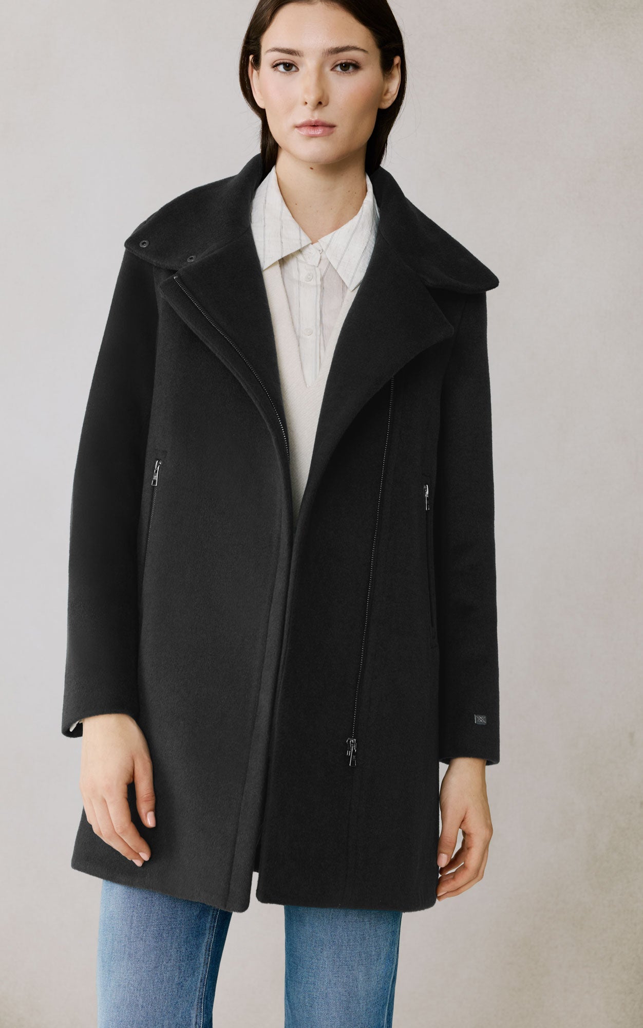 Woman wearing black Soia & Kyo Abbi wool coat with zipper details over white shirt