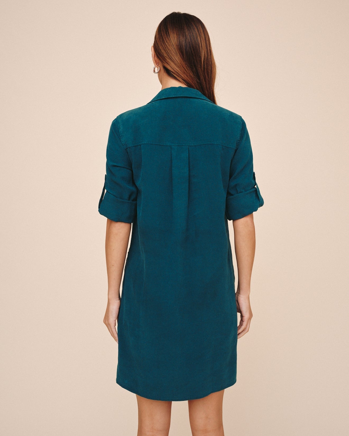 Bella Dahl twilight teal linen shirt dress with rolled sleeves, back view on model