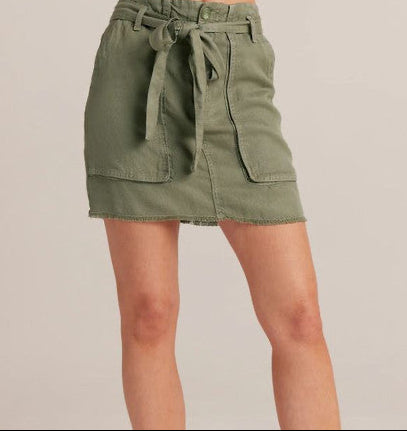 Olive green utility mini skirt with belt tie and front pockets on model