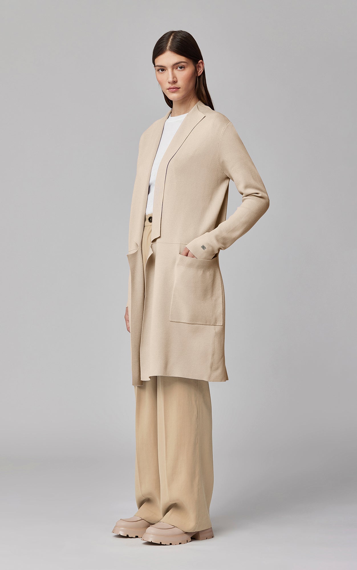 Woman wearing beige Soia & Kyo Benela cardigan with matching wide-leg pants
