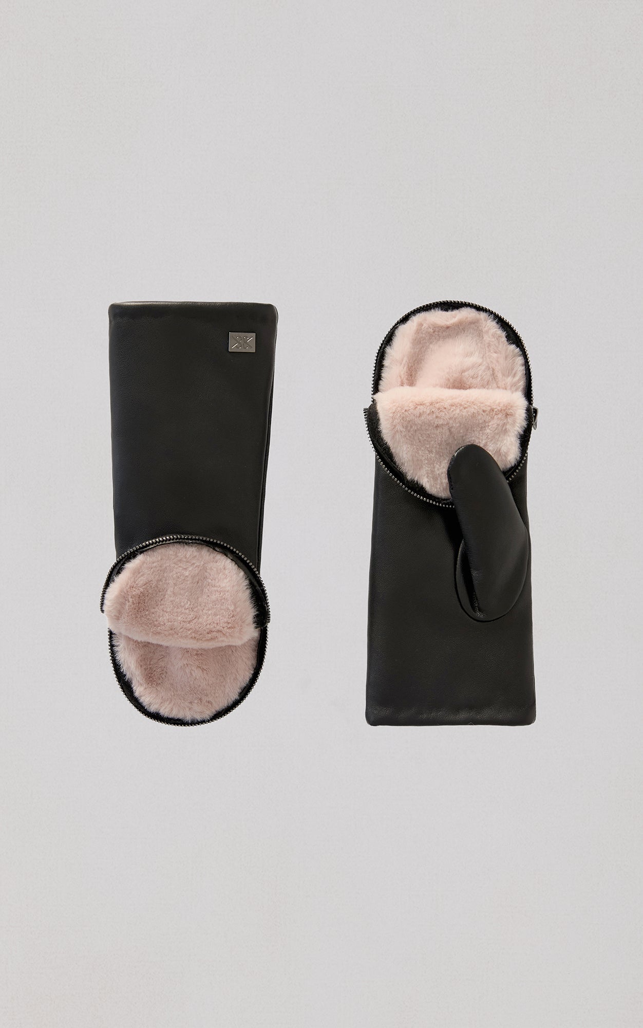 Black leather gloves with pink fur lining, shown open to display interior warmth