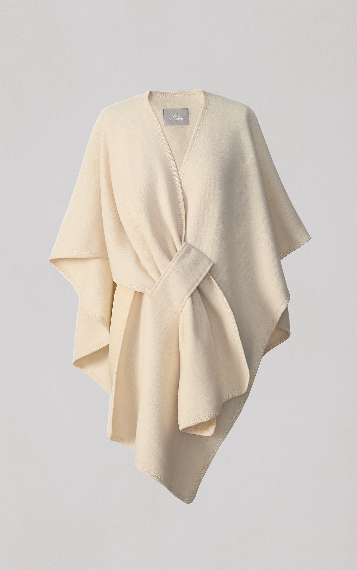 Soia & Kyo Claudelle cream colored wrap scarf with belt tie on neutral background