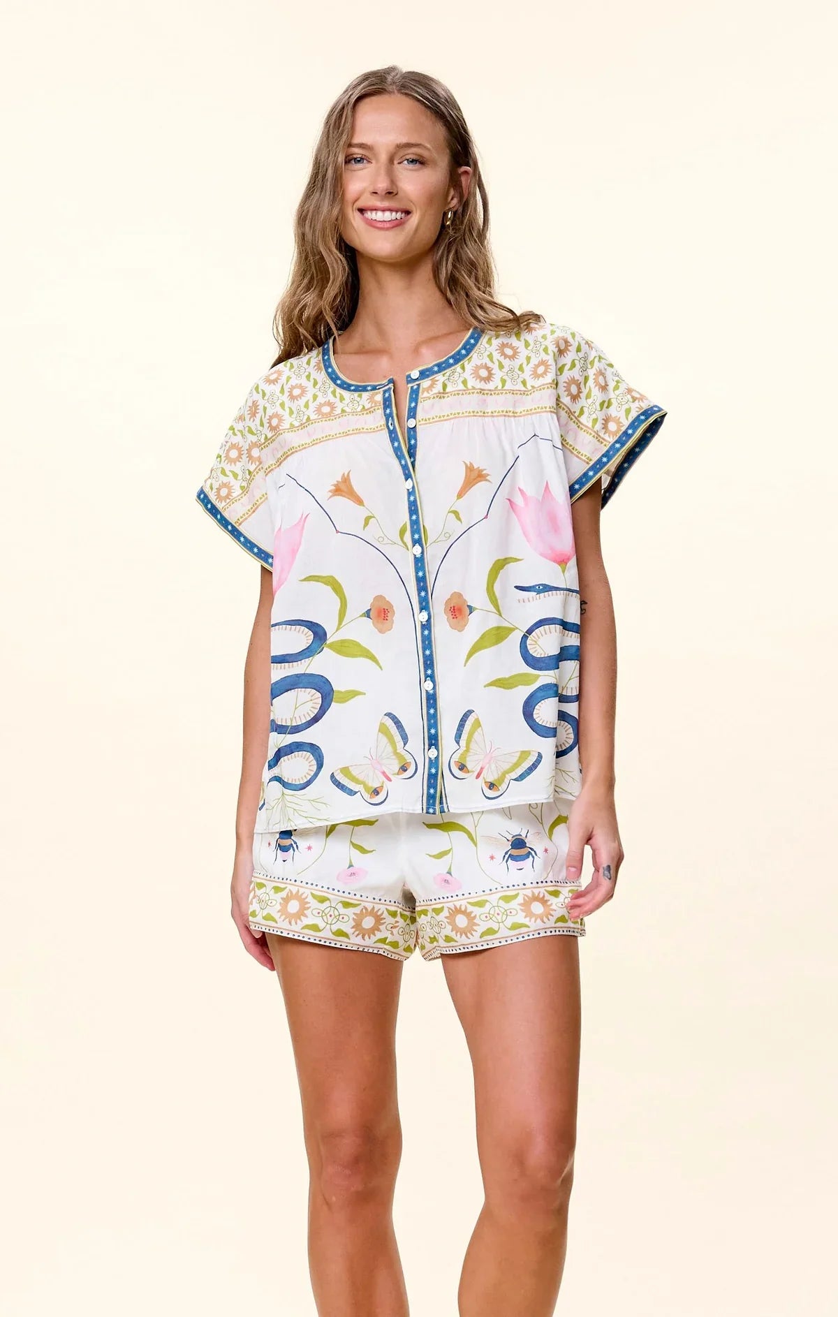 Woman wearing Cleobella Hadley Top in Montecito Print with matching shorts, floral pattern