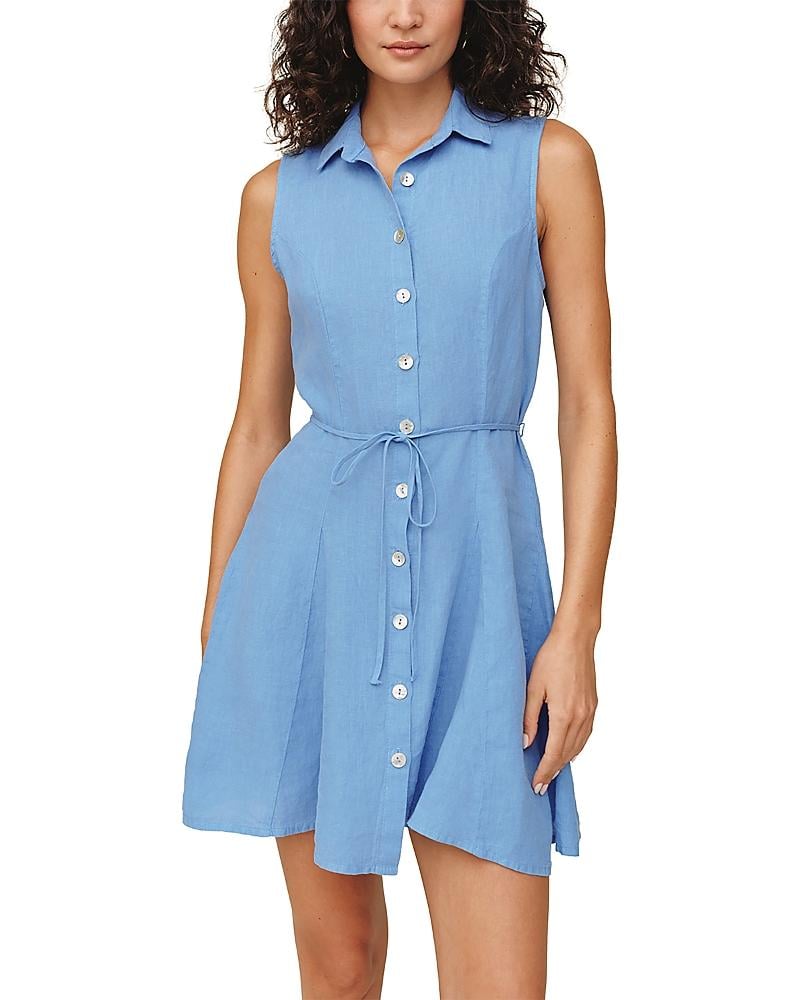 Woman wearing sleeveless ocean blue shirt dress with button front and tie waist