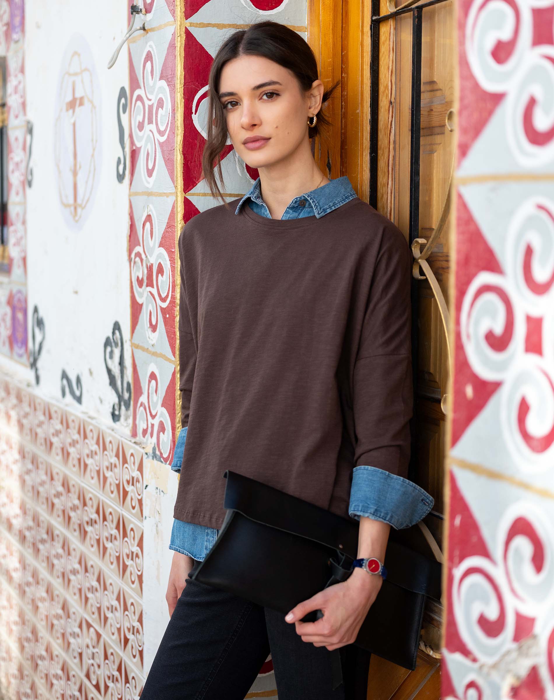 Woman wearing Mer-Sea Catalina Slub Tee in espresso brown layered over denim shirt