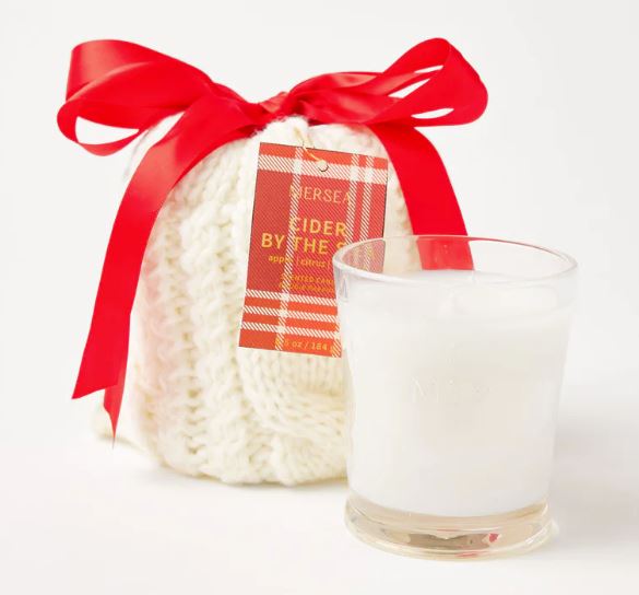 Mer-Sea Cider by the Sea scented candle wrapped in cream knit stocking with red bow
