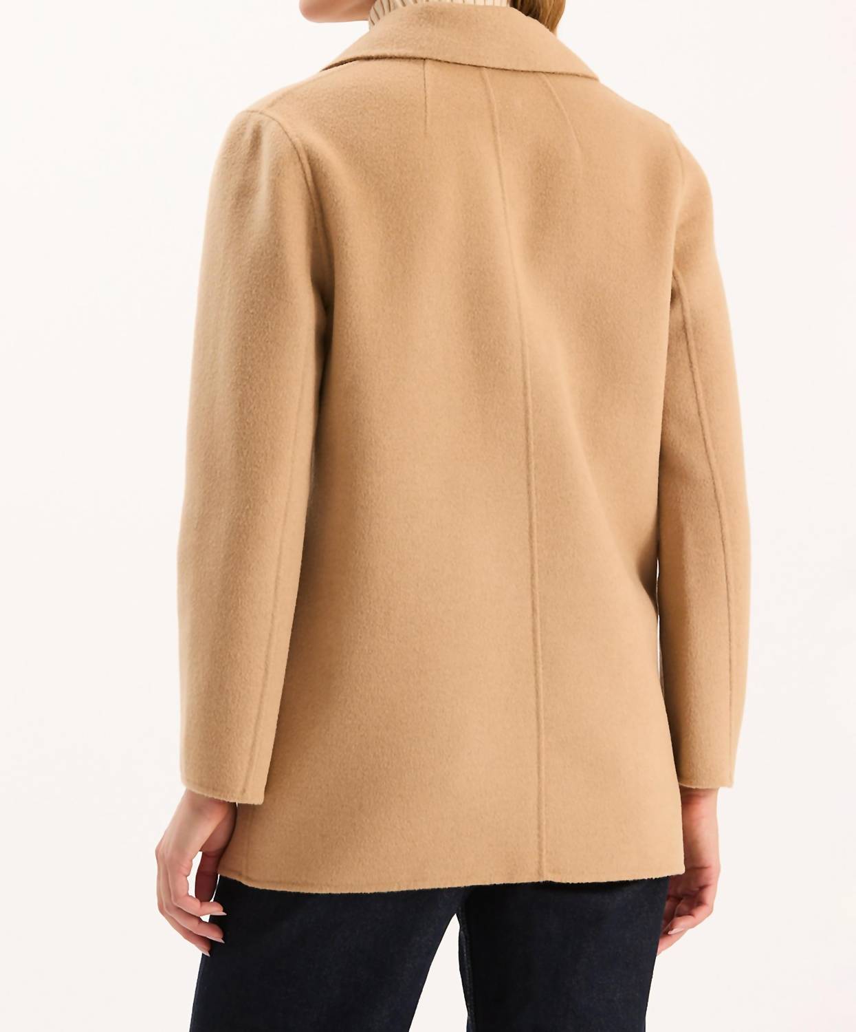Back view of woman wearing camel colored wool car coat with collar