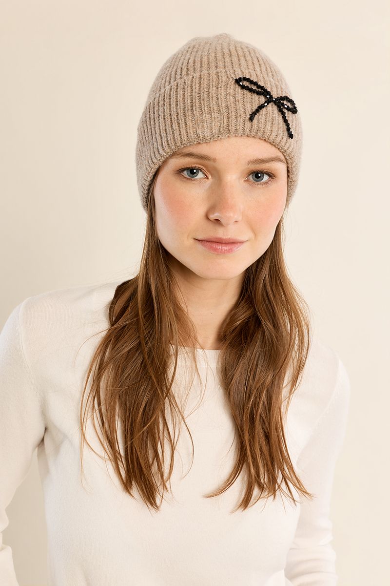 Molly Bracken beige ribbed knit beanie hat with black sequin bow detail