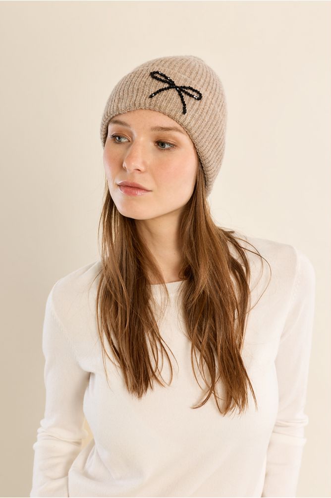 Molly Bracken beige ribbed knit beanie hat with black sequin bow embellishment