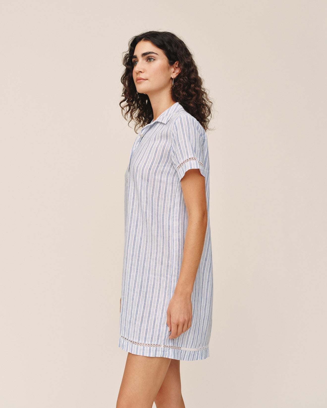 Woman wearing Bella Dahl short sleeve shirt dress in ocean blue stripe pattern