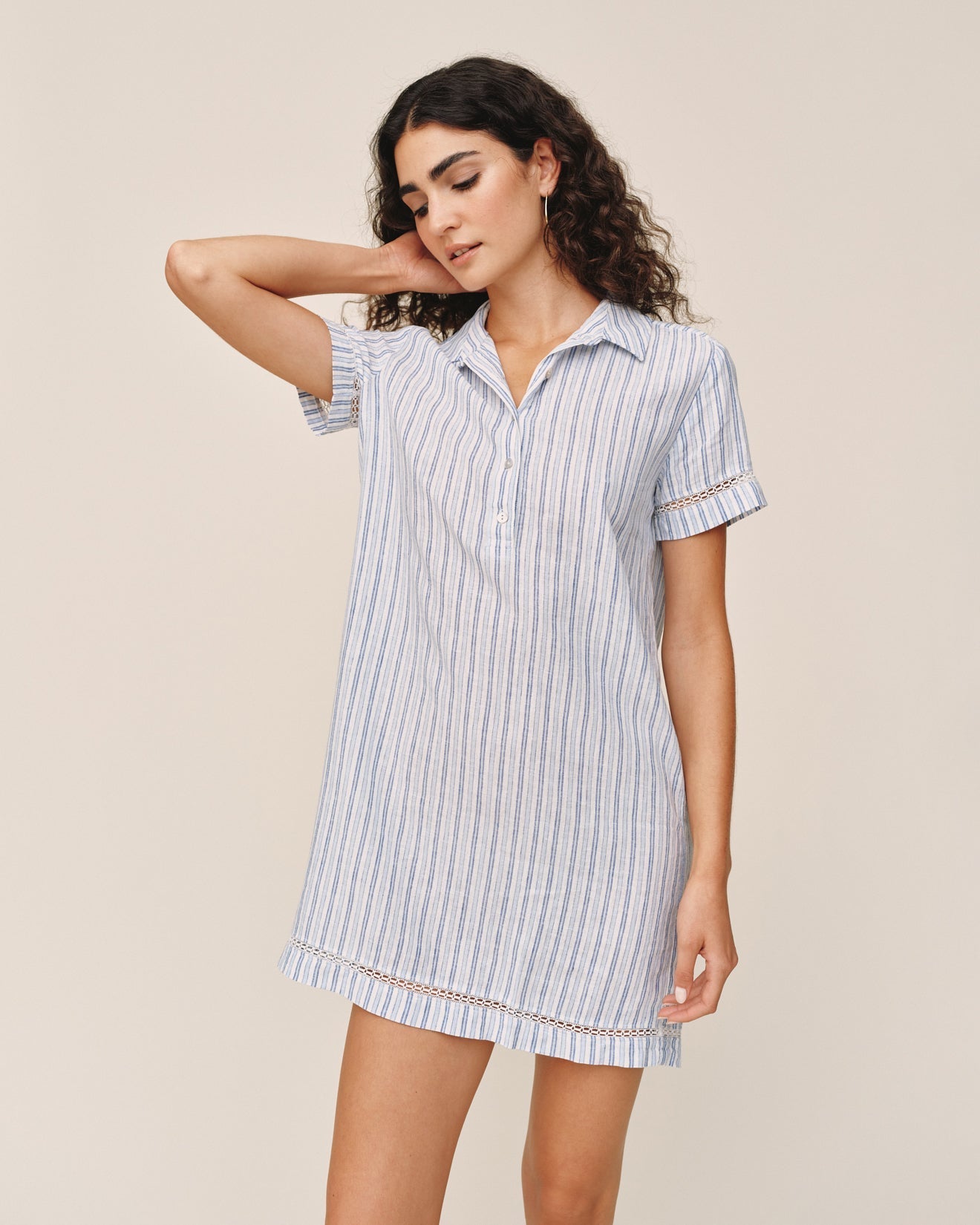 Woman wearing Bella Dahl short sleeve shirt dress in ocean blue stripe pattern