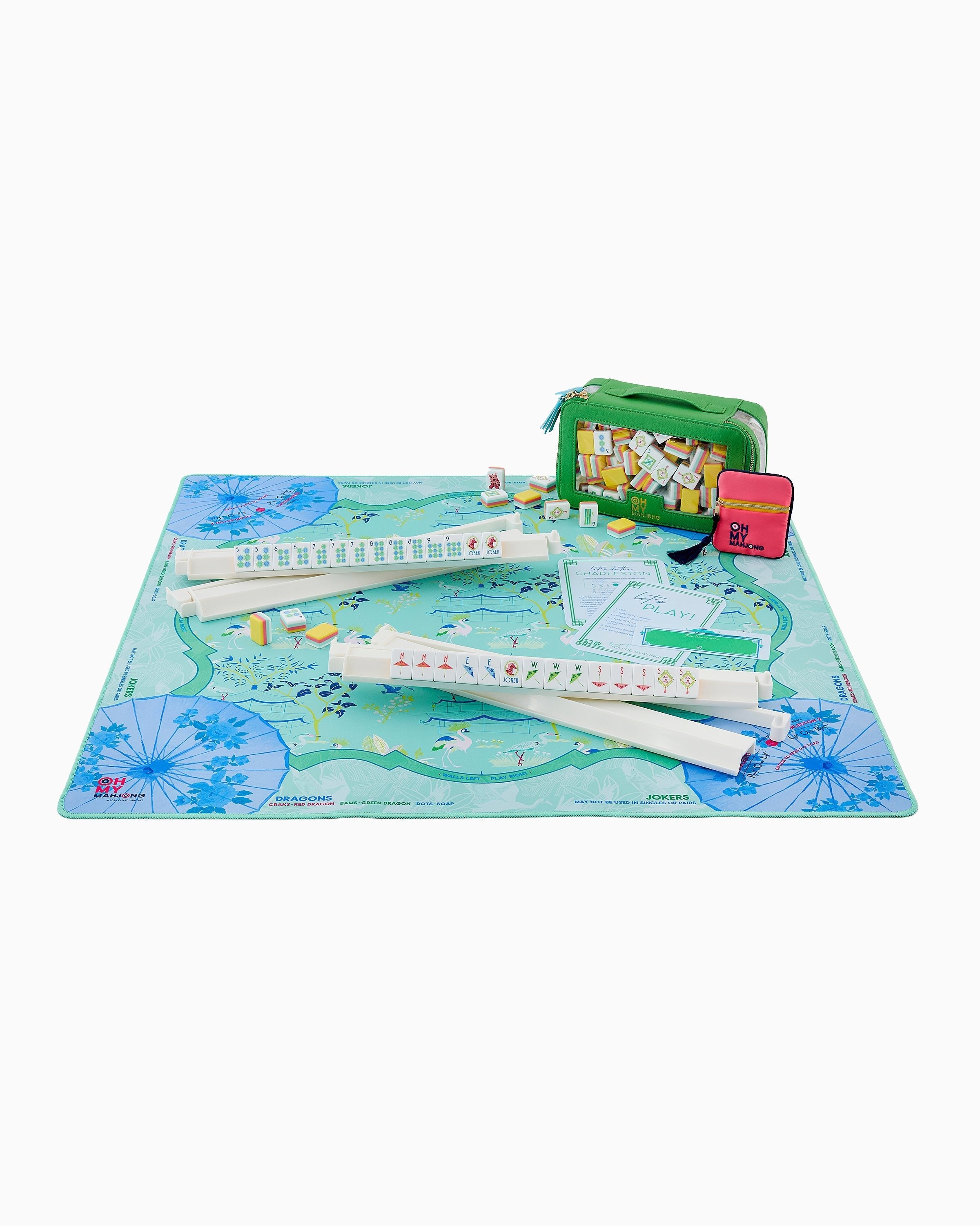 Oh My Mahjong Veranda Mat displayed with full mahjong set on mint blue floral mat